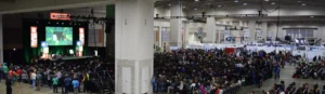 A large crowd of people in an indoor area.