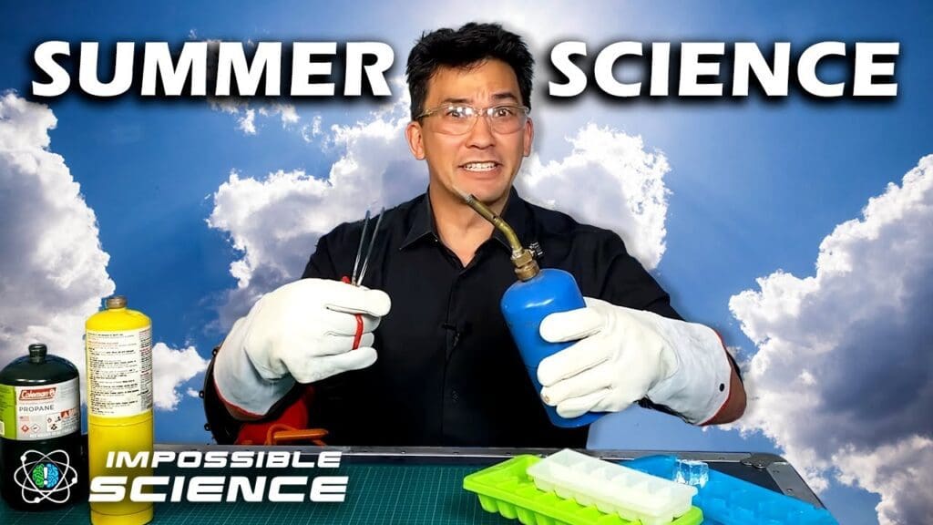A man holding something in his hand and wearing gloves.