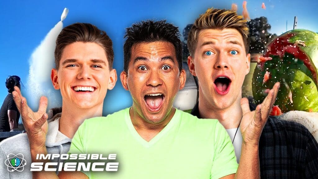 Three men are posing for a picture with one of them smiling.